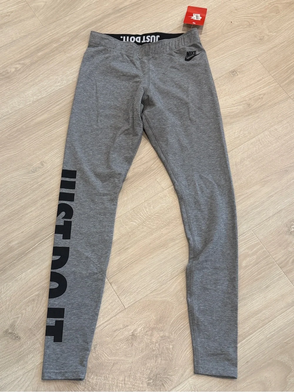 Nike Leg-A-See Just Do It leggings in a heather gray color